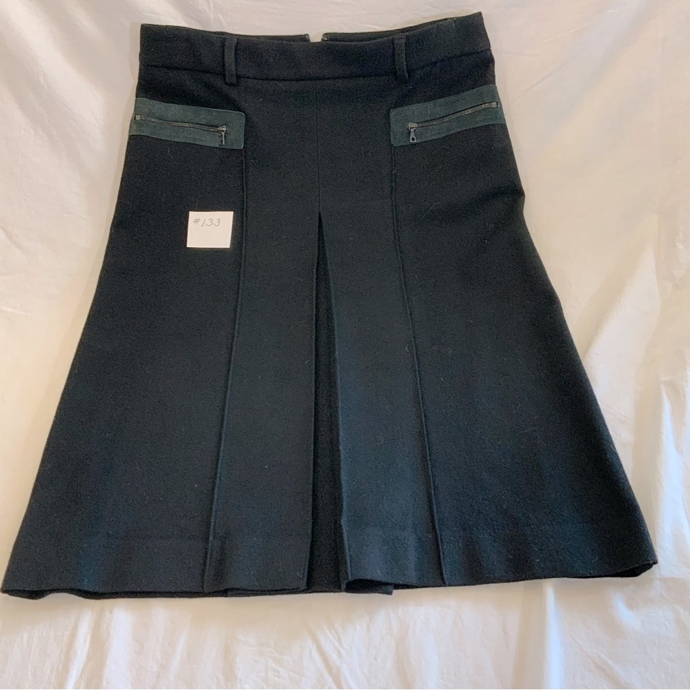 Theory - Black wool with leather zippered front pockets.  Front long pleat.